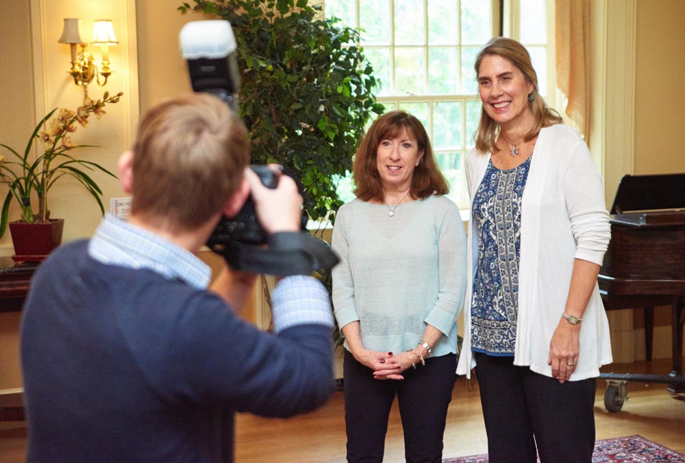 PHOTO OPS: Lynn Shesser ’75N and Lindsey Wilson Minchella ’75N get their photo taken together during the School of Nursing's class photo session.