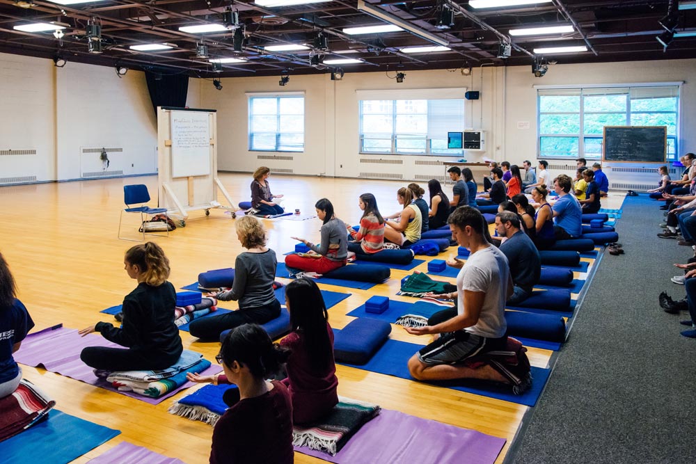 Debra Corea, a faculty member in the Program of Dance and Movement, leads a workshop on meditation and mindfulness in Spurrier Hall.