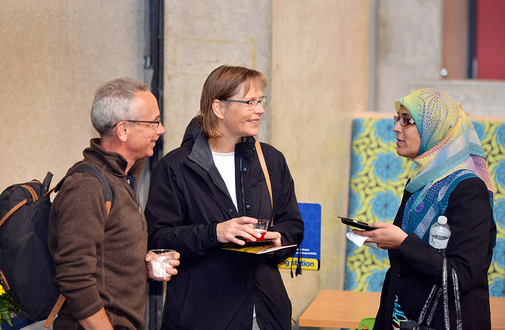 Chris and Tina Elderkin, the parents of Sarah Elderkin ’17, talk with Asma Bawany, the mother of MEL Talk presenter Fatima Bawany ’16 at a reception after the MEL Talks presentation.