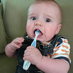 baby with a toothbrush