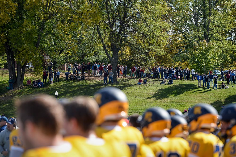 football players with fans in the background