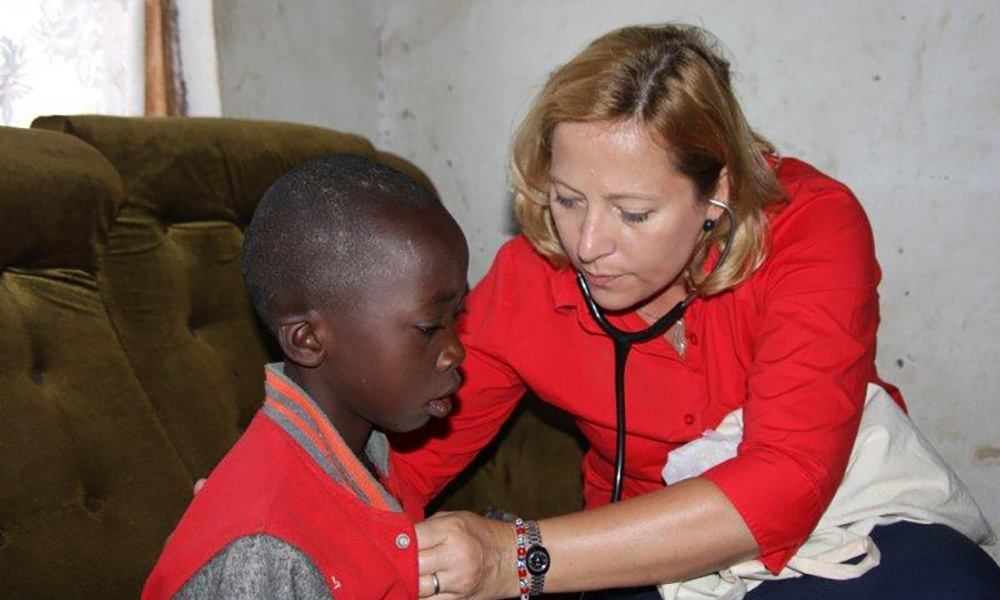 Feature image doctor with a child at African clinic