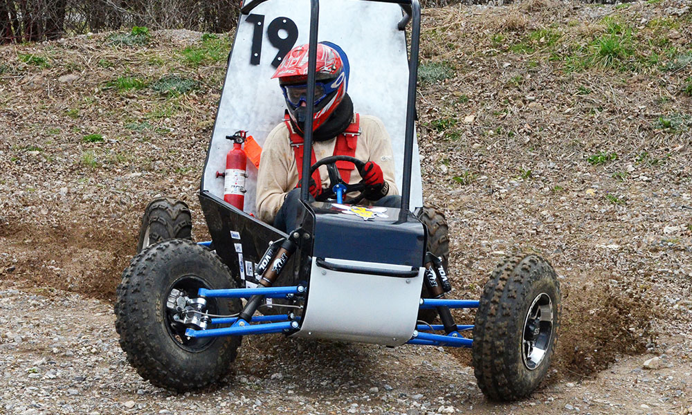 Feature image team member racing baja cart