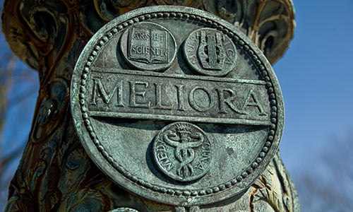 Meliora medallion on flagpole