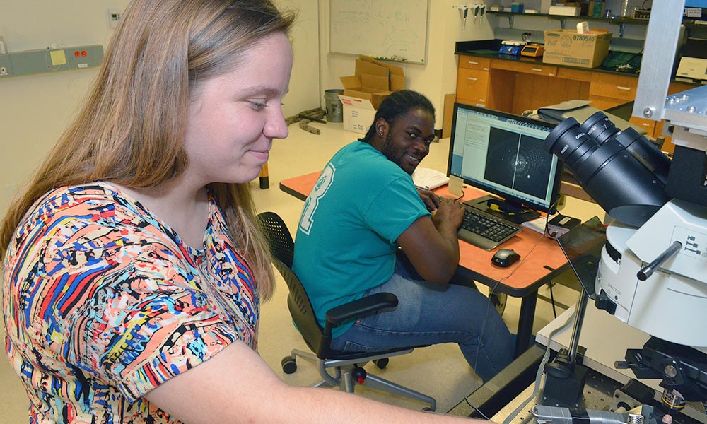 Feature image two students in a lab