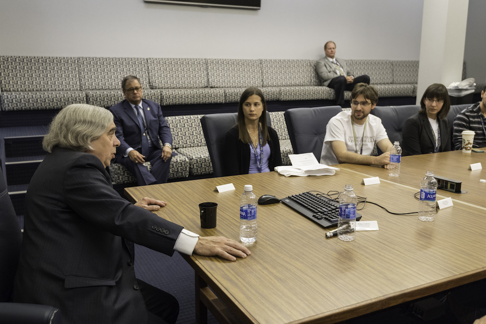 Ernest Moniz meets with students, including (from left) Katelyn Sharma, Andrew Davies, and Amanda Davis. (University photo/J. Adam Fenster)