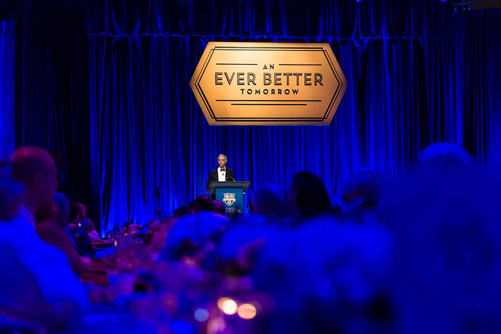 Joel Seligman on stage at dinner