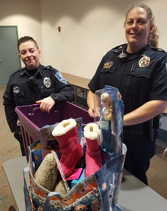 Officer Tiffany Street (left) and Lt. Keri Stein help launch the Department of Public Safety's Willow Center holiday donation program.