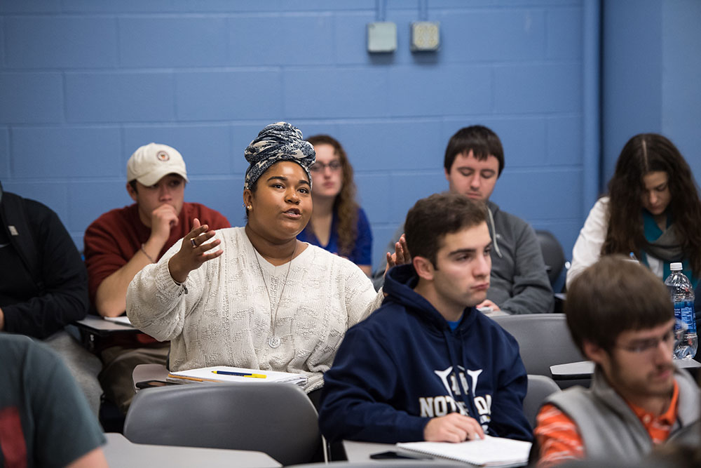 student speaking in a classroom