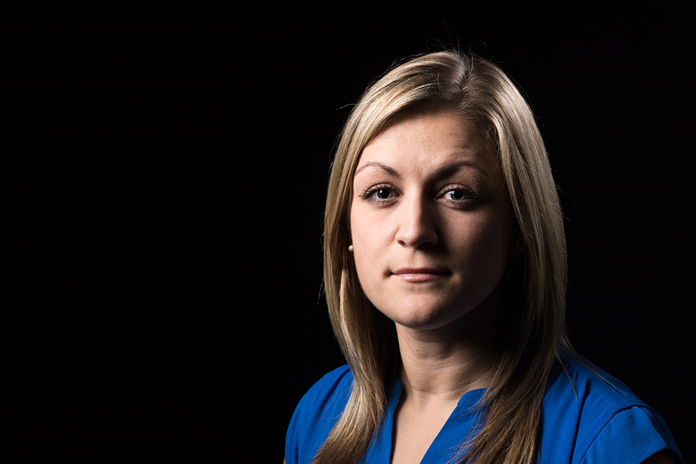 woman in front of black background