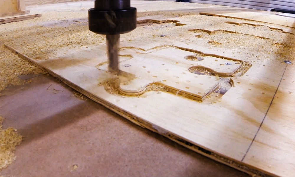drill creating a puzzle piece in wood