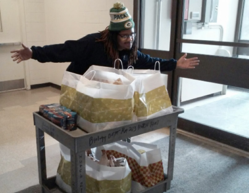 person pushing a cart filled with frood