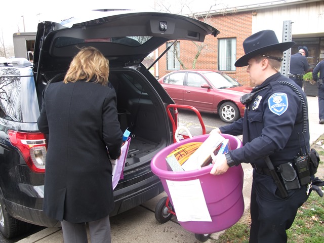 two women load toys into a car