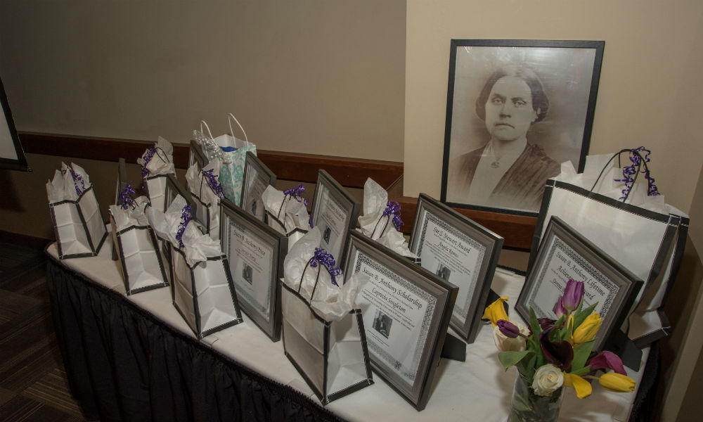 Feature image table full of awards and photo of Susan B. Anthony