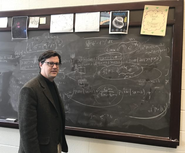 Andrew Jordan at a blackboard