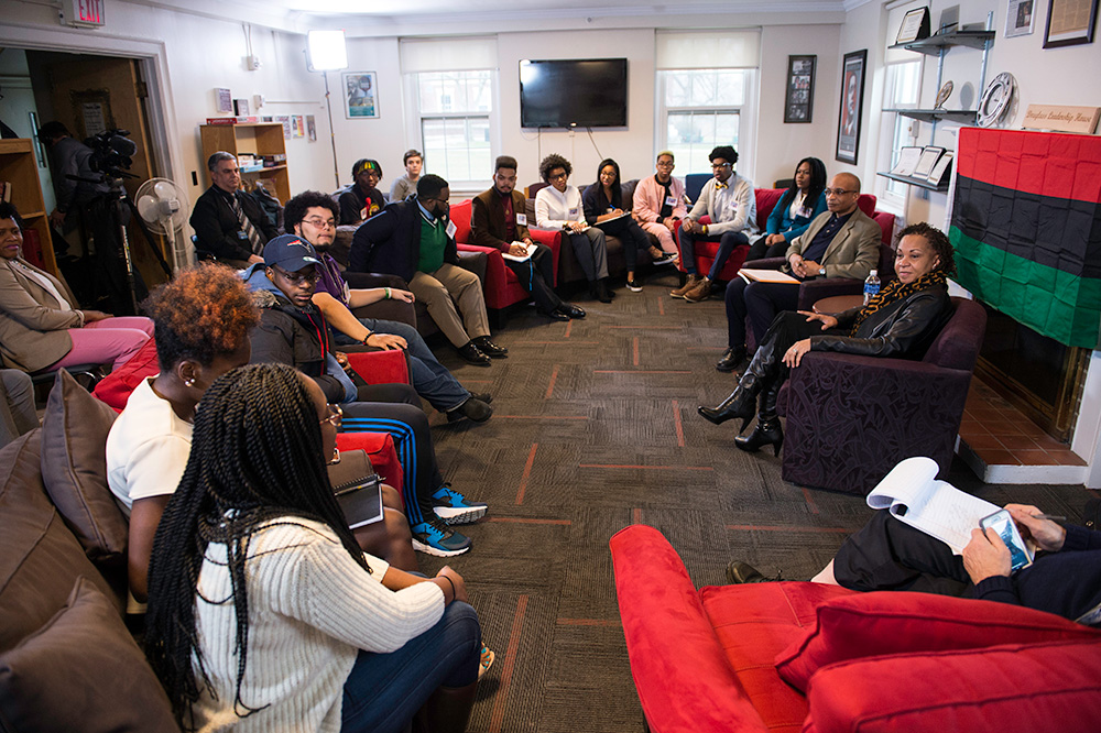 Feature image Joy DeGruy speaks to a large crowd of students at Douglass Leadership House