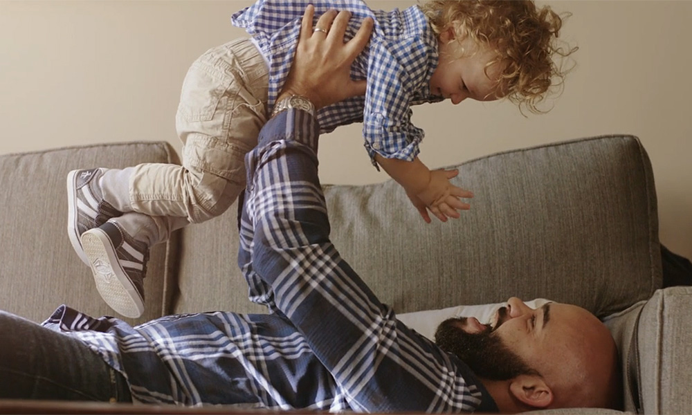 Feature image father lifting a child