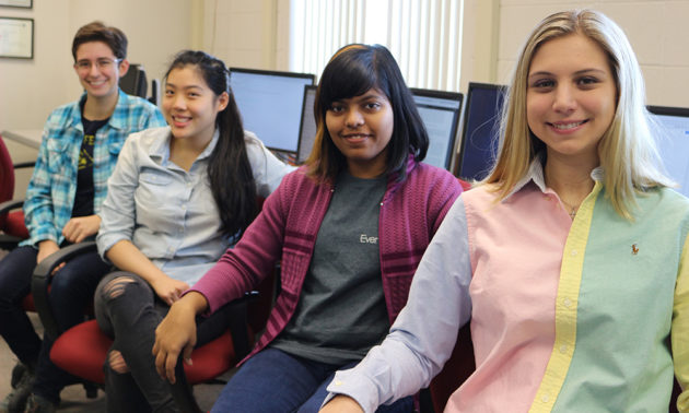 four students in lab