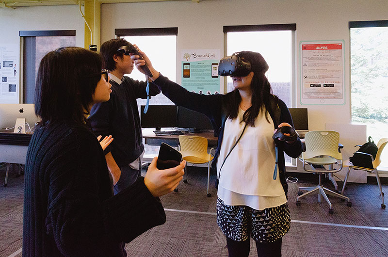 Student playing online games and video games while wearing a virtual reality headset