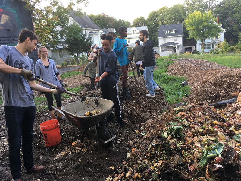 students tending compost pile