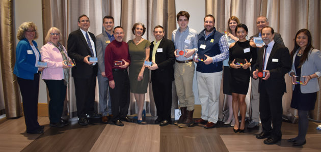 large group portrait, with people holding awards