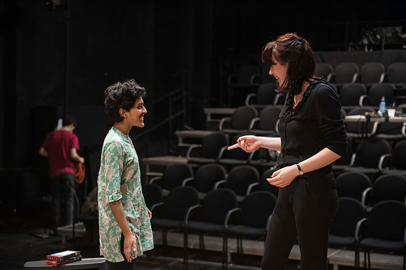 director and stage manager sharing a laugh