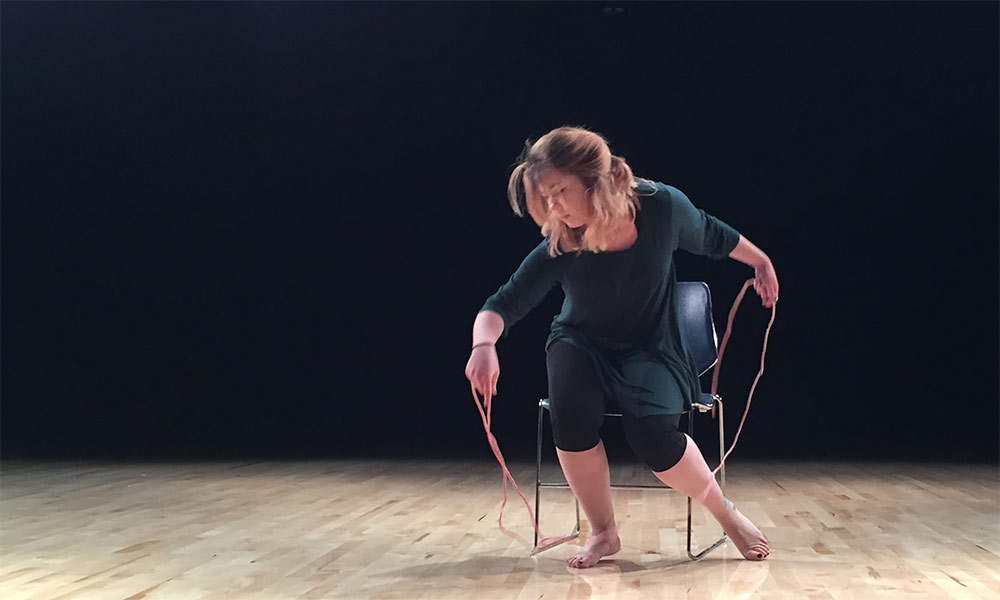 Feature image dancer on a chair on stage