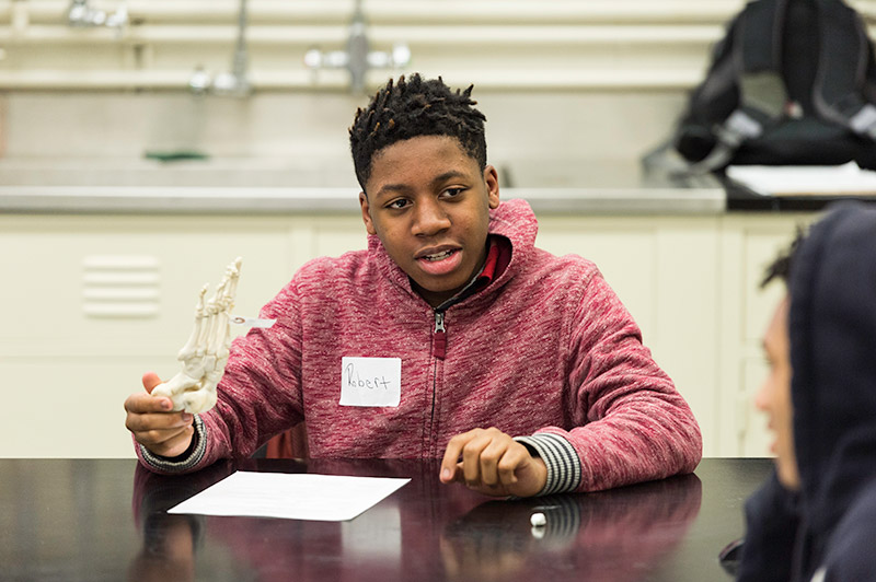 student speaking in class