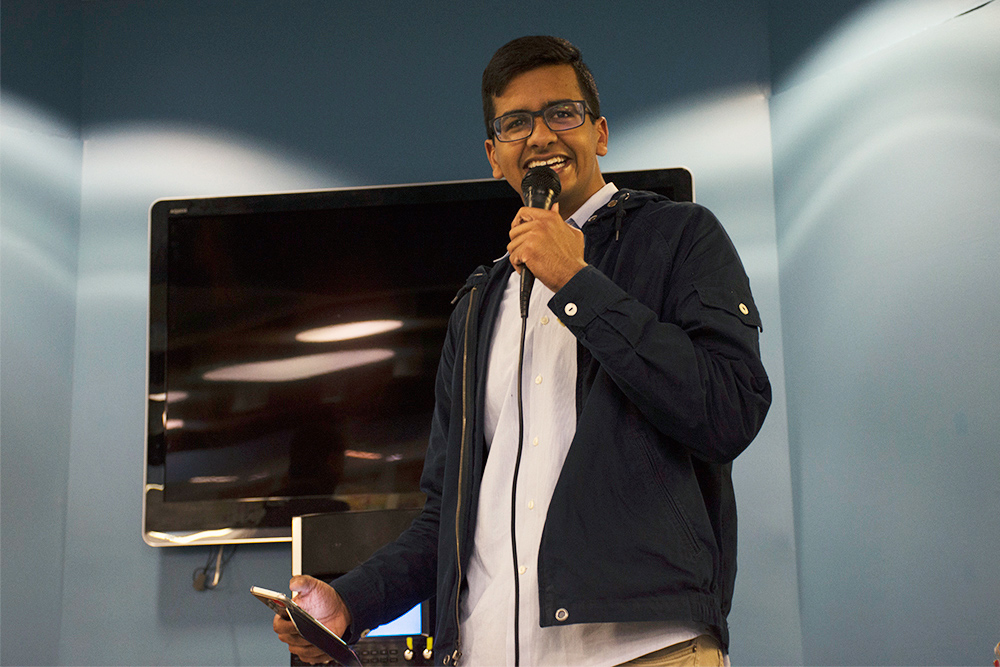 Feature image student with microphone performing standup