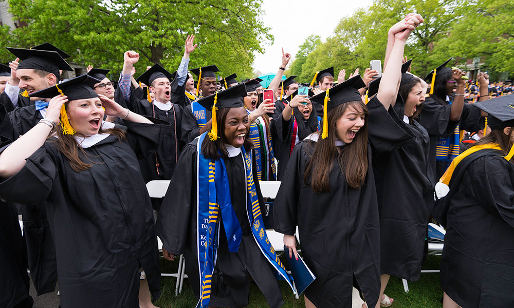Feature image large crowd of graduates celebrating