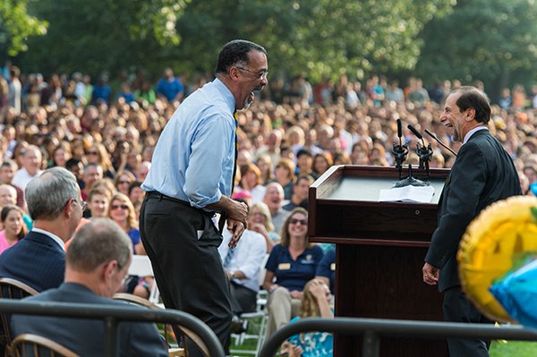 Paul Burgett laughs at the podium with Rich Feldman