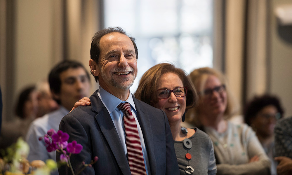 Richard Feldman and his wife Andrea smiling in a crowd of people