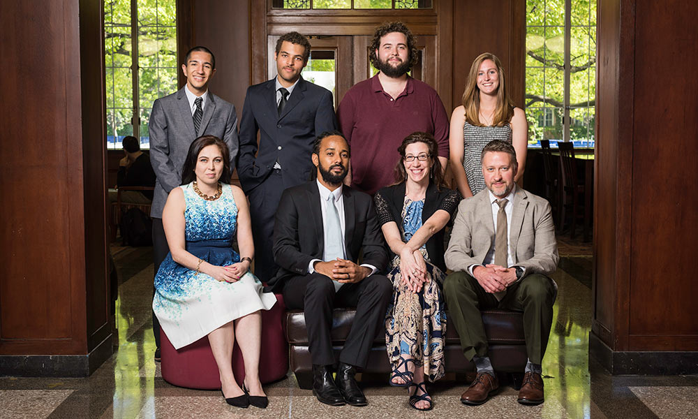 Feature image photo of four students with four teachers