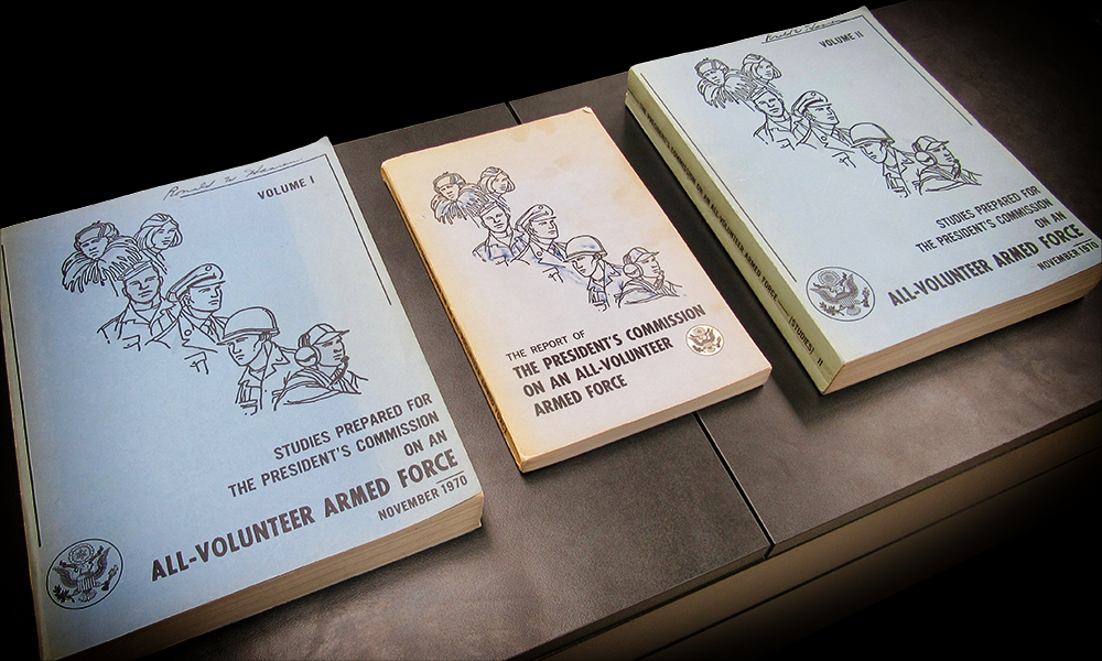table with three copies of the Gates Commission report