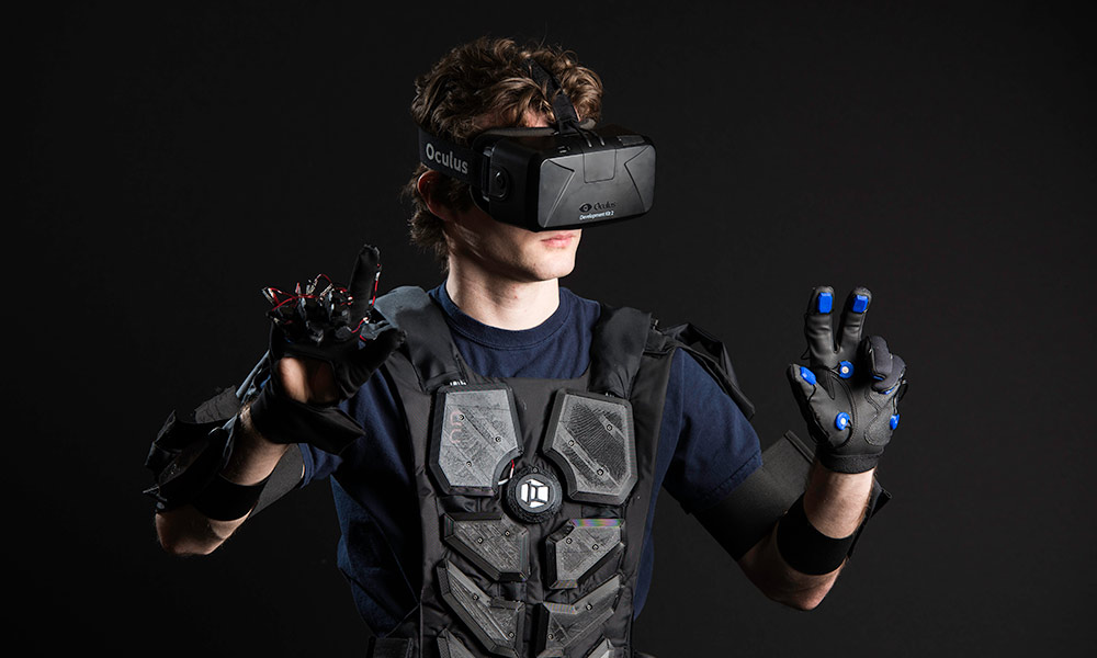 Feature image man wearing a virtual reality suit and goggles