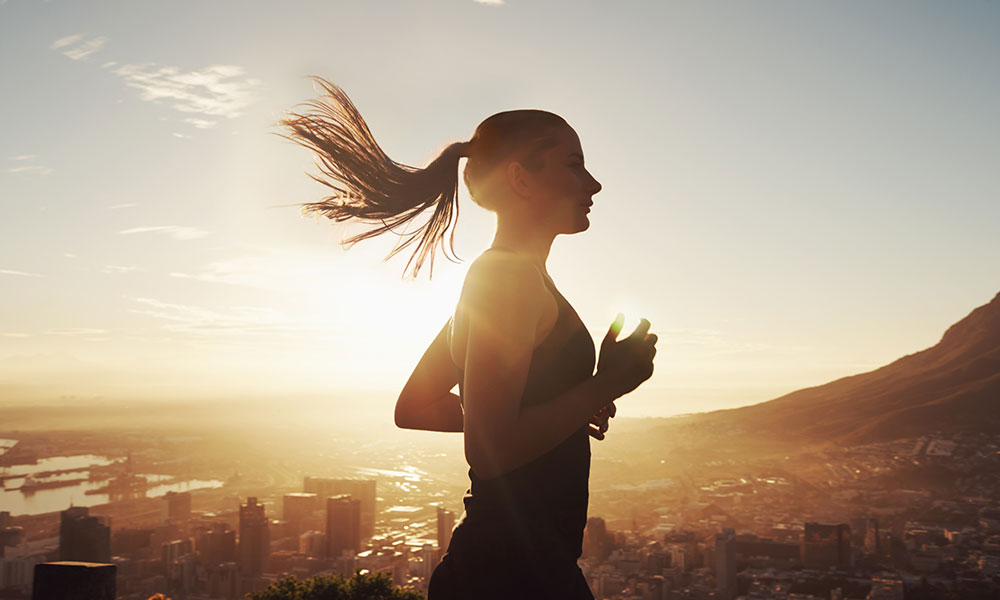 woman running in the bright sunshine