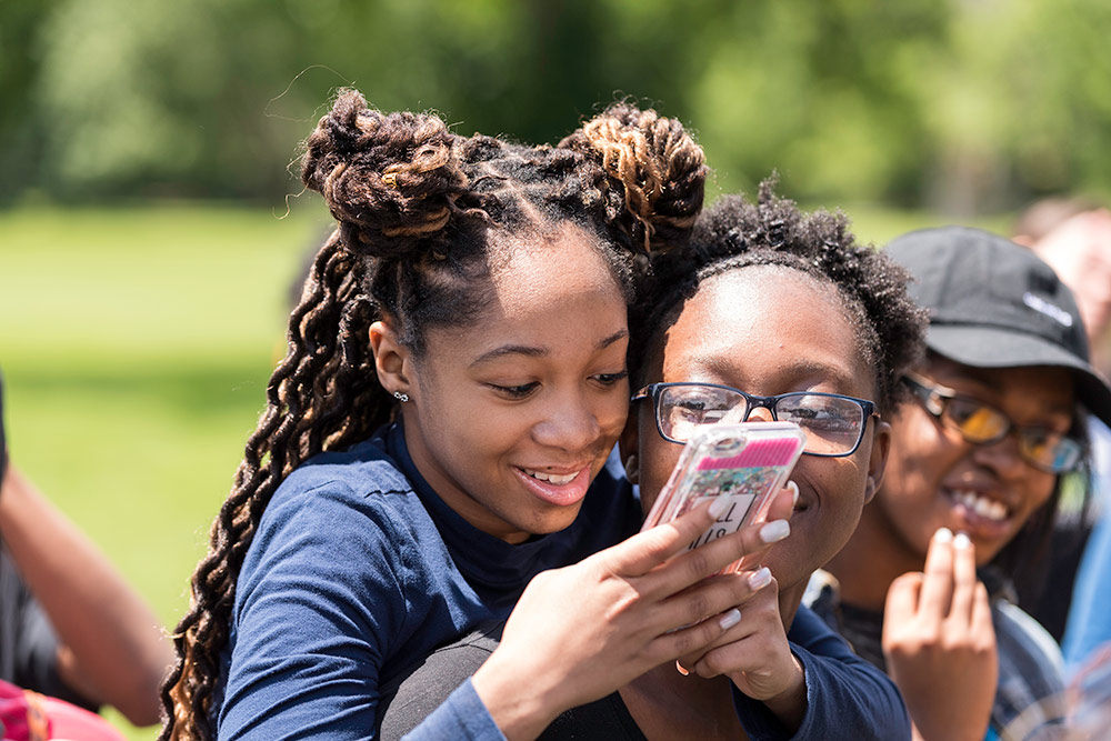 two students on cell phones