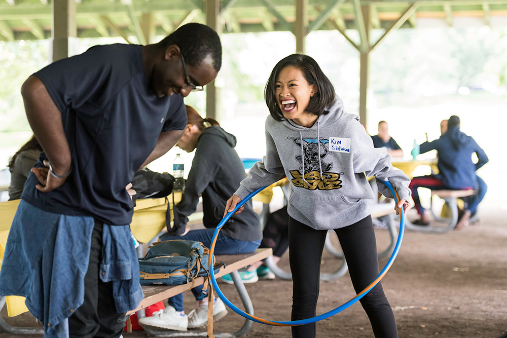 two students with hula hoops