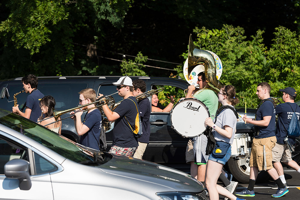 band between lines of cars