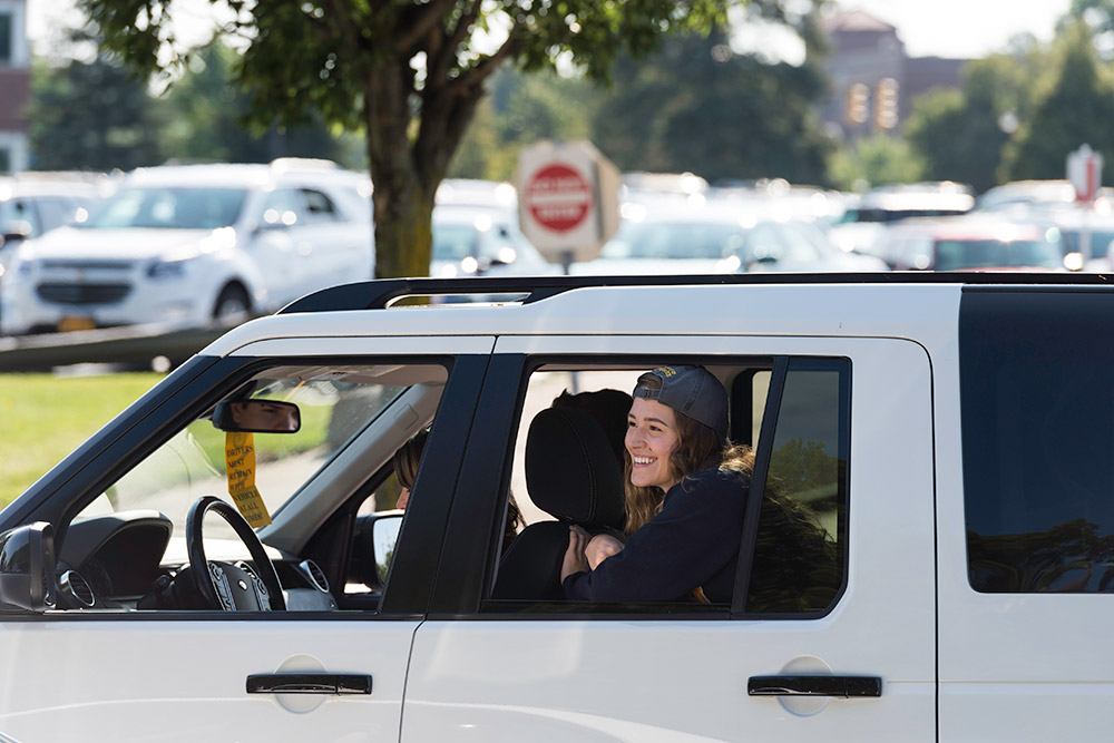 smiling student in car