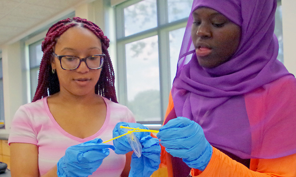 two high school students in lab