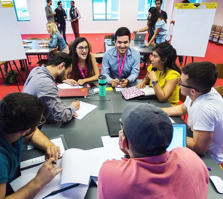 group of people working around a table