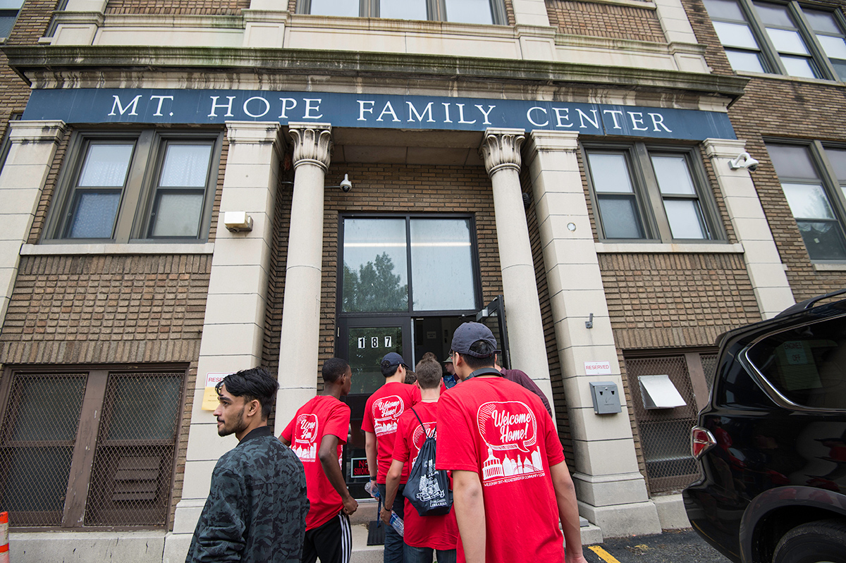 students walking into a building marked Mt. Hope Family Center