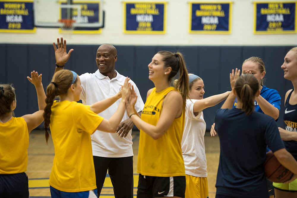 basketball players giving each other high fives