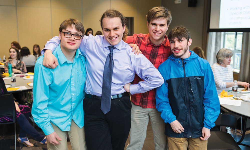 four students posing for a photo