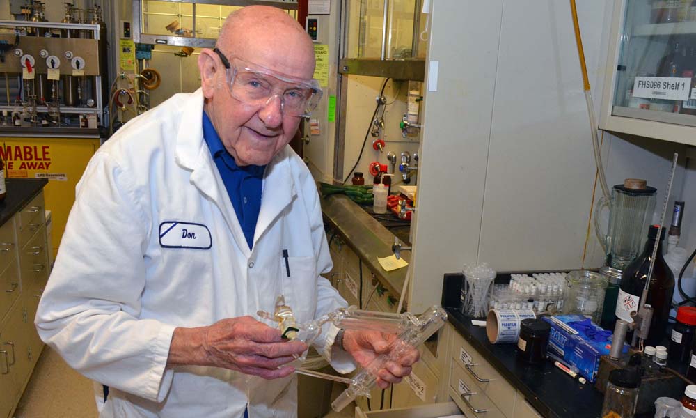 Feature image Donald Batesky holds test tubes in the lab