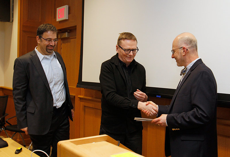 three men shaking hands
