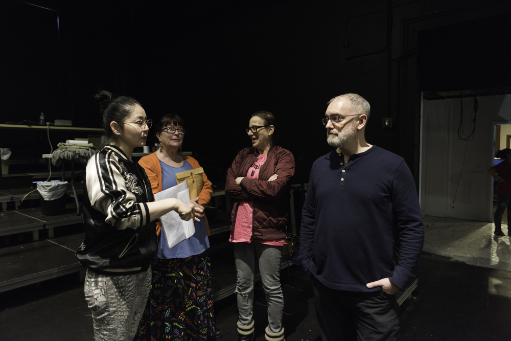 four students with director Ken Rus Schmoll
