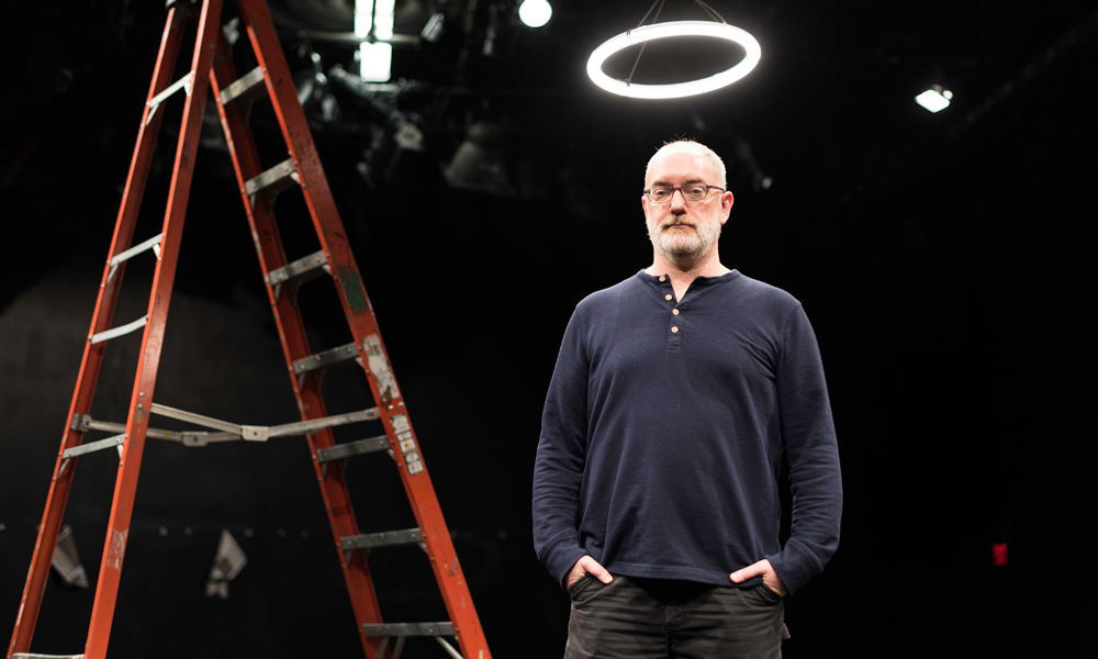 director standing on stage