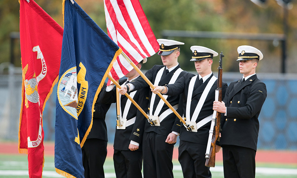 NROTC color guard holding flags